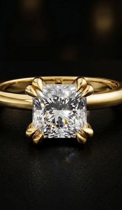 Front view of a 1.5 carat princess cut diamond solitaire engagement ring in an 18kt yellow gold 4 double claw setting by TJ Diamond