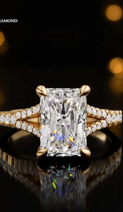 Front view of a radiant cut split shank lab-grown diamond engagement ring in 18kt yellow gold.
