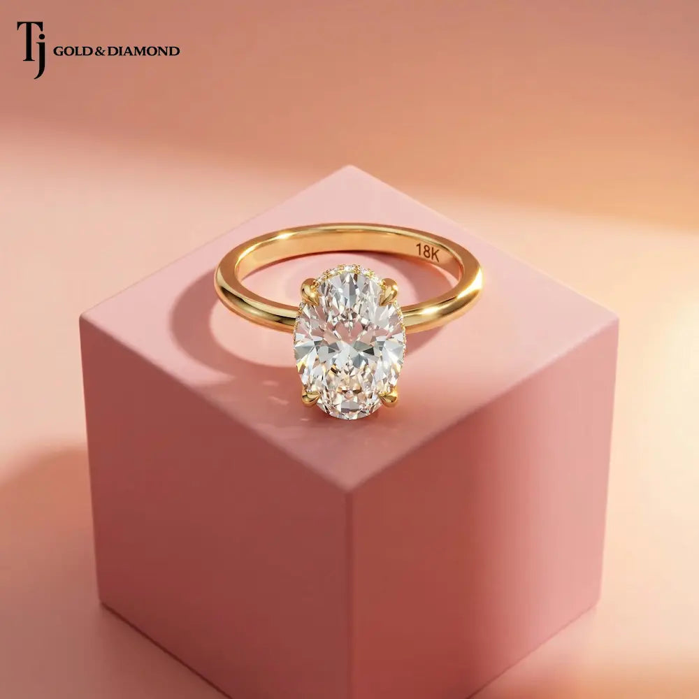 4ct oval lab-grown diamond solitaire engagement ring in 18kt yellow gold with hidden diamond halo.