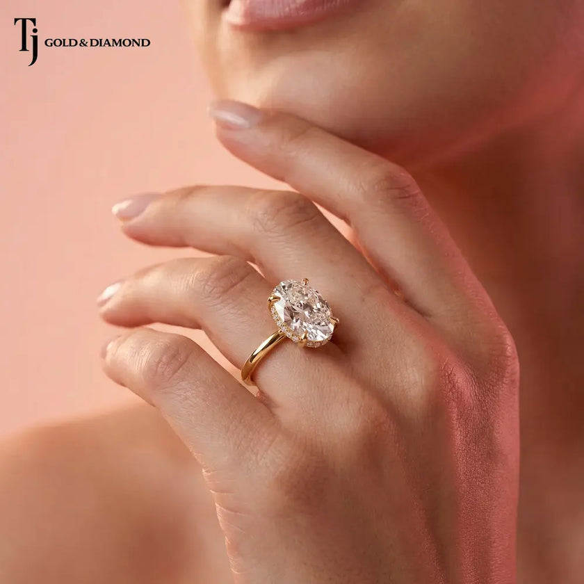 Lifestyle photograph of a handcrafted 4ct oval lab-grown diamond engagement ring in 18kt yellow gold.