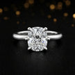Front view of a 1.5 carat cushion cut diamond solitaire engagement ring in an 18kt white gold 6 claw setting by TJ Diamond