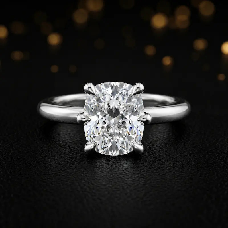 Front view of a 1.5 carat cushion cut diamond solitaire engagement ring in an 18kt white gold 6 claw setting by TJ Diamond
