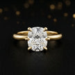 Front view of a 1.5 carat cushion cut diamond solitaire engagement ring in an 18kt yellow gold 6 claw setting by TJ Diamond