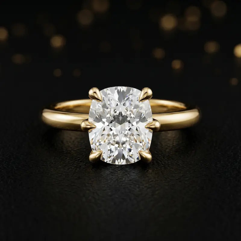 Front view of a 1.5 carat cushion cut diamond solitaire engagement ring in an 18kt yellow gold 6 claw setting by TJ Diamond