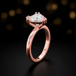 Front-on view of a 1.5 carat heart cut diamond solitaire engagement ring showing the full 18kt rose gold band and 6 claw cathedral setting by TJ Diamond