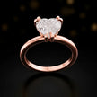 Front view of a 1.5 carat heart cut diamond solitaire engagement ring in an 18kt rose gold 6 claw setting by TJ Diamond