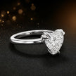Angled side view of a 1.5 carat heart cut diamond solitaire engagement ring in an 18kt white gold 6 claw setting by TJ Diamond