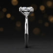 Side profile of a 1.5 carat heart cut diamond solitaire engagement ring showing the cathedral setting and 18kt white gold band by TJ Diamond
