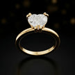 Front view of a 1.5 carat heart cut diamond solitaire engagement ring in an 18kt yellow gold 6 claw setting by TJ Diamond