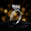 Angled side view of a 1.5 carat marquise cut diamond solitaire engagement ring in an 18kt white gold 6 claw setting by TJ Diamond