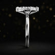 Side profile of a 1.5 carat marquise cut diamond solitaire engagement ring showing the cathedral setting and 18kt white gold band by TJ Diamond