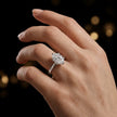 1.5 carat oval cut diamond solitaire engagement ring in an 18kt white gold 6 claw setting worn on a hand, by TJ Diamond