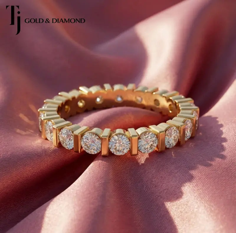 Front view of a full eternity diamond wedding band featuring a bar setting and round brilliant lab-grown diamonds in 18kt yellow gold.