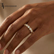 Full eternity diamond wedding band in 18kt yellow gold worn on hand with round brilliant lab-grown diamonds in a modern bar setting.