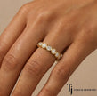 Bezel setting full eternity diamond wedding band in 18kt yellow gold worn on hand with round brilliant lab-grown diamonds.