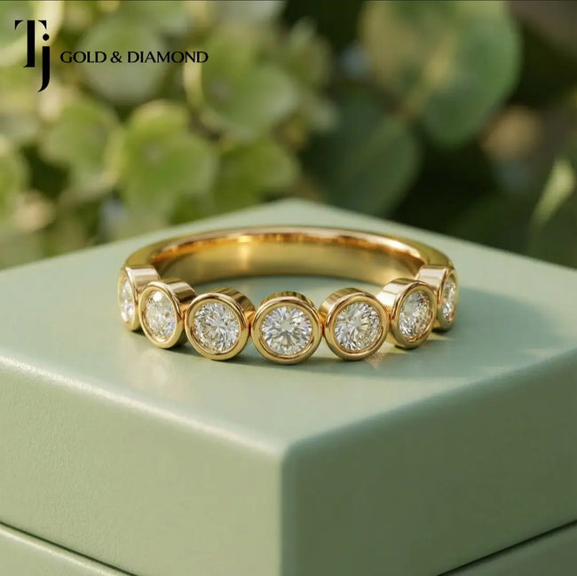 Front view of Bezel Setting Half Eternity diamond wedding band in 18kt yellow gold.