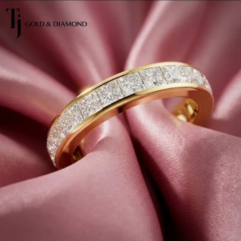 Full eternity diamond wedding band featuring a channel setting in 18kt yellow gold with princess cut lab-grown diamonds.
