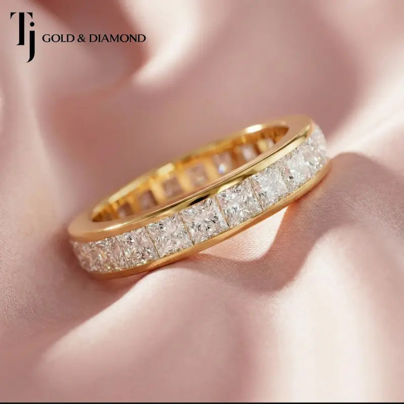 Luxury channel setting full eternity diamond wedding band crafted in 18kt yellow gold with princess cut lab-grown diamonds.