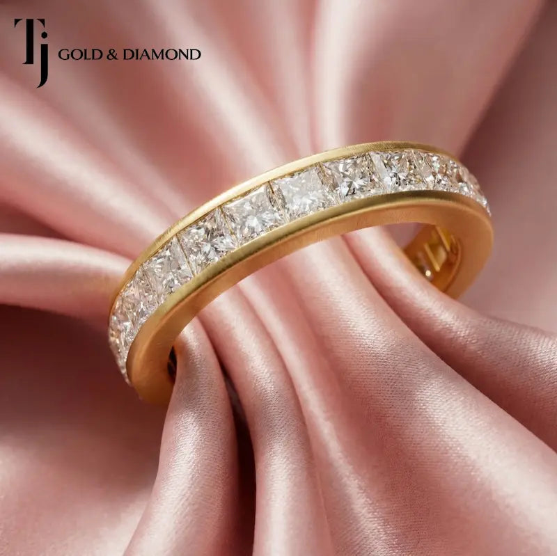 Channel setting full eternity diamond wedding band in 18kt yellow gold with princess cut lab-grown diamonds.