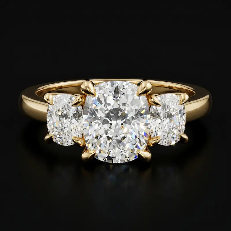 Front view of a cushion-cut lab-grown diamond trilogy engagement ring in 18ct yellow gold with matching cushion-cut side diamonds.