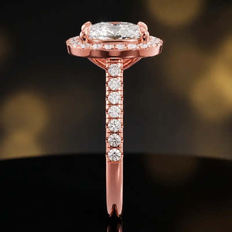 Side profile of a cushion cut halo lab-grown diamond engagement ring in 18kt rose gold.