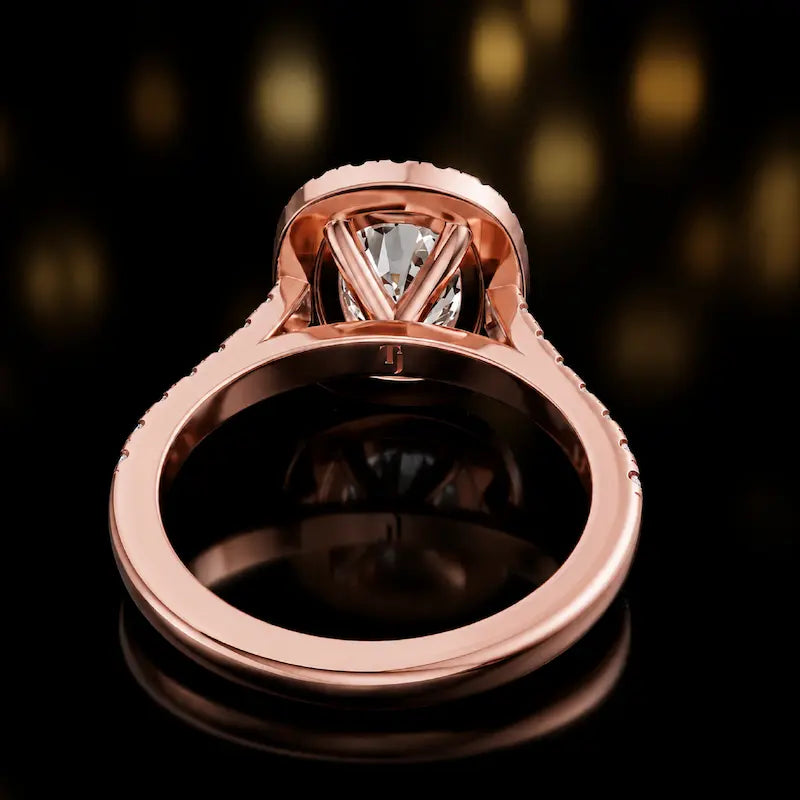 Rear profile of a cushion cut halo lab-grown diamond engagement ring with diamond-set shoulders in 18kt rose gold.