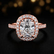 Close-up front view of a cushion cut halo lab-grown diamond engagement ring in 18kt rose gold.
