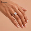 1.5 carat cushion cut lab-grown diamond solitaire engagement ring in 18kt rose gold worn on the hand