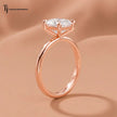 1.5 carat cushion cut lab-grown diamond solitaire engagement ring in 18kt rose gold with a 4-claw setting, side angle view