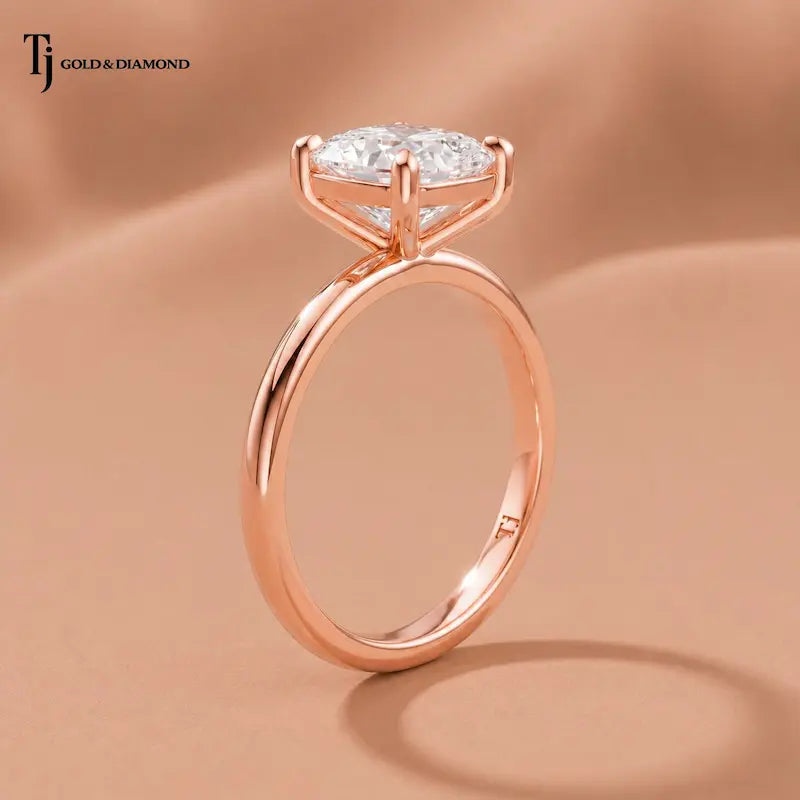 1.5 carat cushion cut lab-grown diamond solitaire engagement ring in 18kt rose gold with a 4-claw setting, side angle view