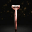 Side profile of a 1.5 carat cushion cut diamond solitaire engagement ring showing the cathedral setting and 18kt rose gold band by TJ Diamond