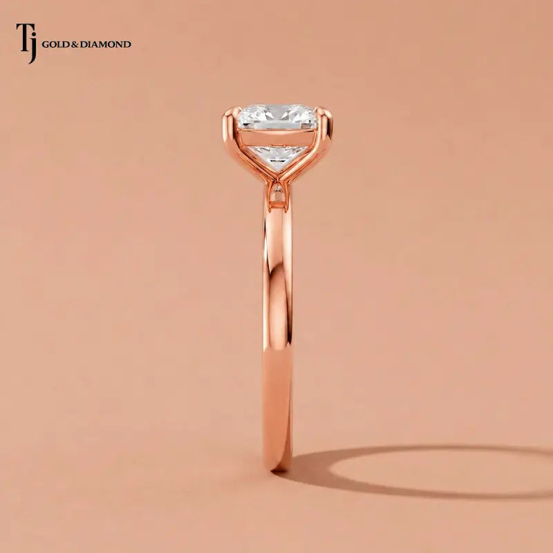 1.5 carat cushion cut lab-grown diamond solitaire engagement ring in 18kt rose gold, raised side view on satin