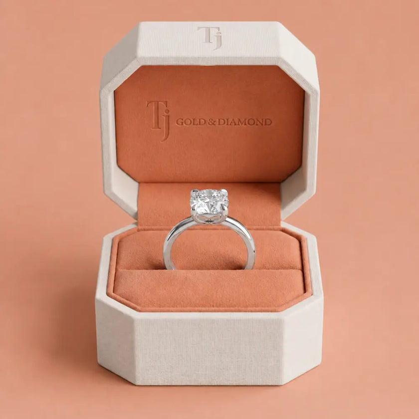 1.5 carat cushion cut lab-grown diamond solitaire engagement ring presented in a TJ Diamond box