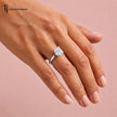 1.5 carat cushion cut lab-grown diamond solitaire engagement ring in 18kt white gold worn on hand
