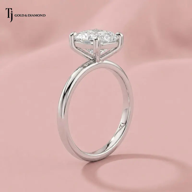  Raised side view of a 1.5 carat cushion cut lab-grown diamond solitaire engagement ring in 18kt white gold on satin