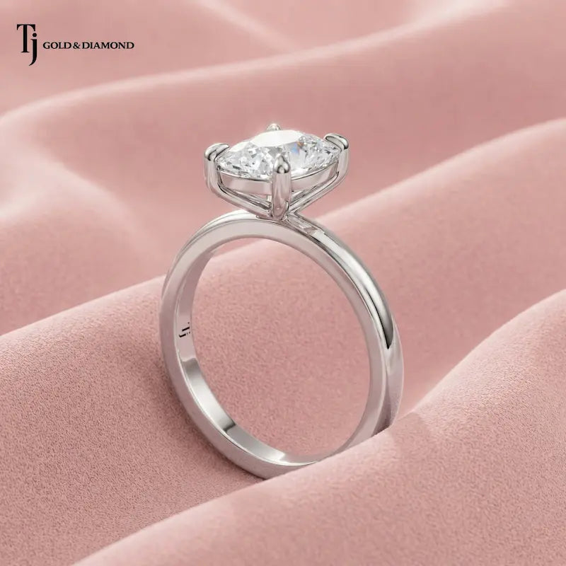 Side view of a 1.5 carat cushion cut lab-grown diamond solitaire engagement ring in 18kt white gold on satin