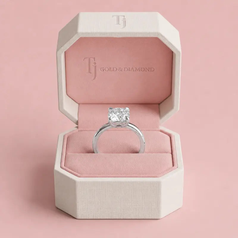 Boxed view of a 1.5 carat cushion cut lab-grown diamond solitaire engagement ring in 18kt white gold in a TJ Gold & Diamond box