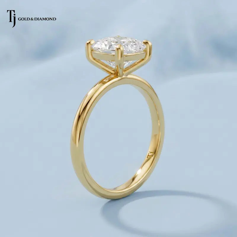 Angled view of a 1.5 carat cushion cut lab-grown diamond solitaire engagement ring in 18kt yellow gold with a 4-claw setting