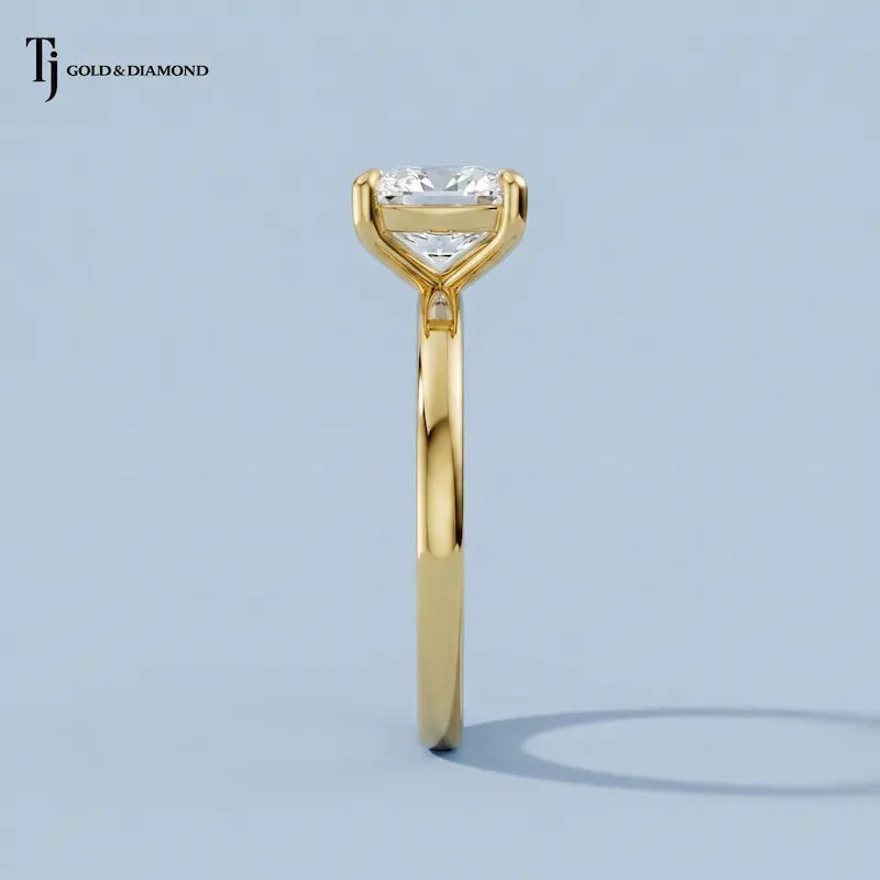 Side profile view of a 1.5 carat cushion cut lab-grown diamond solitaire engagement ring in 18kt yellow gold