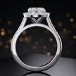 Side view of a cushion cut halo lab-grown diamond engagement ring with diamond-set shoulders in 18kt white gold.