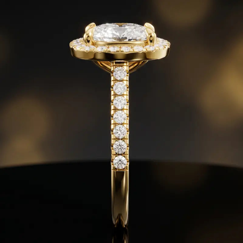 Side profile of a cushion cut halo lab-grown diamond engagement ring in 18kt yellow gold.
