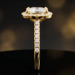 Side profile of a cushion cut halo lab-grown diamond engagement ring in 18kt yellow gold.