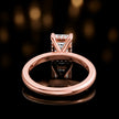 Back view of 4-claw emerald cut engagement ring with hidden halo in 18kt rose gold