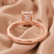 Back view of a 1.5 carat emerald cut lab-grown diamond solitaire engagement ring in 18kt rose gold with a 4-claw setting