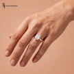 1.5 carat emerald cut lab-grown diamond solitaire engagement ring in 18kt rose gold worn on hand