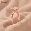  Side profile view of a 1.5 carat emerald cut lab-grown diamond solitaire engagement ring in 18kt rose gold
