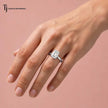 1.5 carat emerald cut lab-grown diamond solitaire engagement ring in 18kt white gold worn on hand