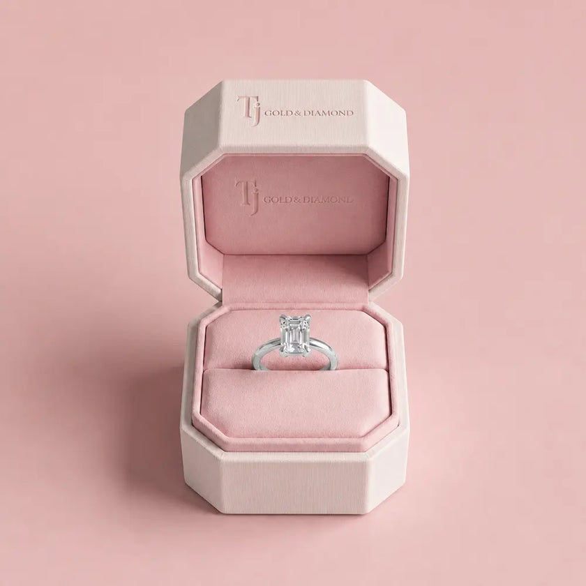1.5 carat emerald cut lab-grown diamond solitaire engagement ring in 18kt white gold in a TJ Diamond box