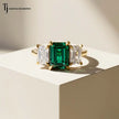Front View of an Emerald Cut Lab-Created Emerald & Lab-Grown Diamond Trilogy Ring in 18kt yellow gold.