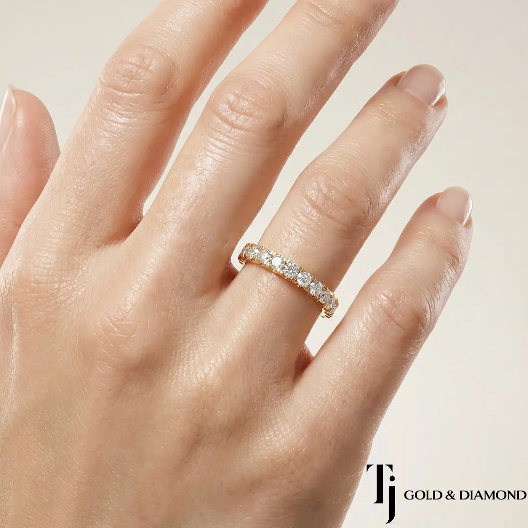 Claw Fish Tail Half Eternity diamond wedding band worn on hand, 18kt yellow gold with round brilliant lab-grown diamonds